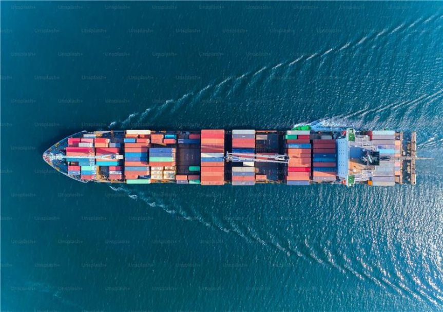 Aerial top view container ship with crane bridge for load container, logistics import export, shipping or transportation concept background